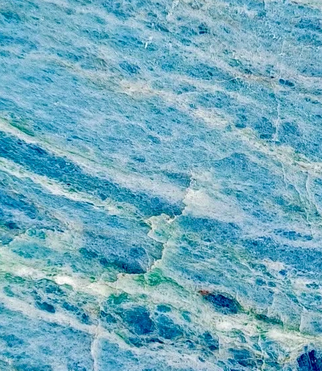 Close-up of Aotea stone showing blue-green and pale banding, South Westland, New Zealand
