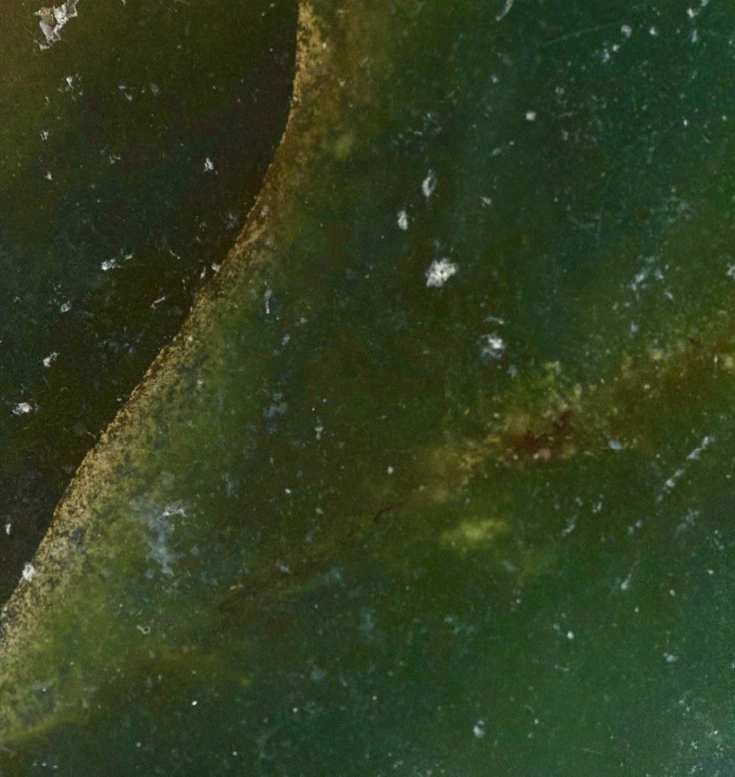 Close-up of Bowenite tangiwai showing deep green, olive and blue-green colour variation