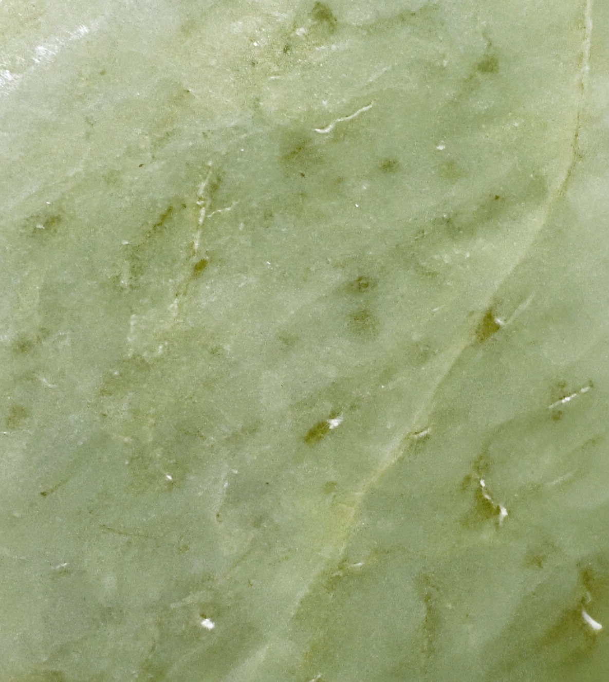 Macro close-up of pale green hydrogrossular from Orepuki, Southland